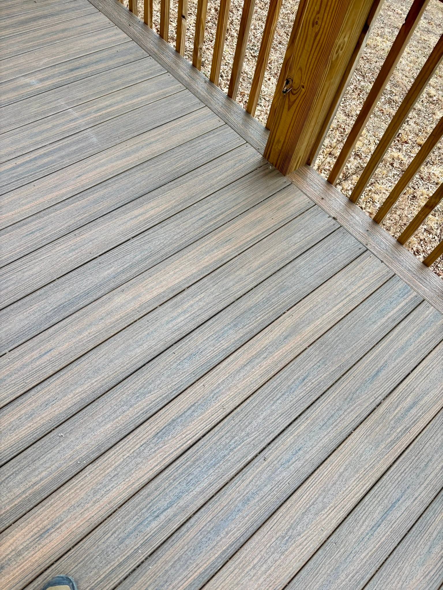 Gray composite re-decking and wood railing detail in Union County, GA